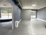 Unfurnished room featuring concrete flooring and an ornate ceiling