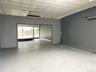 Empty room with an ornate ceiling and concrete floors