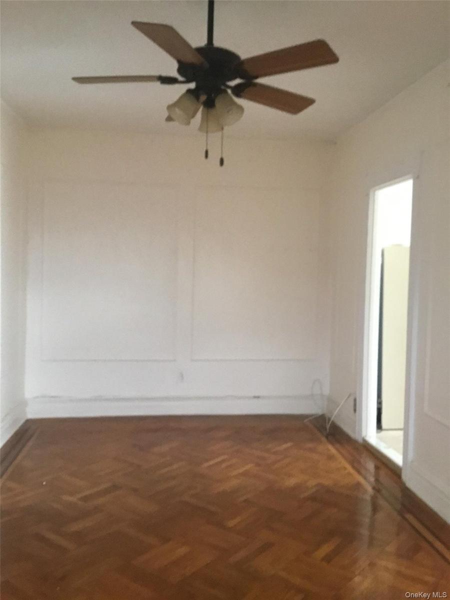 Spare room with ceiling fan