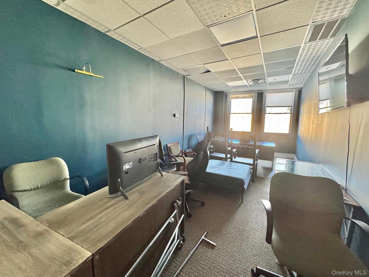 Office area with a paneled ceiling