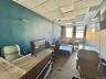 Office area with a paneled ceiling