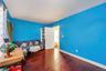Living area featuring hardwood / wood-style flooring and baseboards