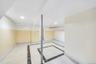 Finished basement with baseboards and recessed lighting