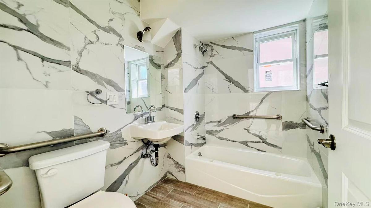 Full bathroom with tub / shower combination and a sink