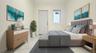 Bedroom with light marble finish floors and baseboards