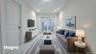 Living area with marble finish flooring and recessed lighting