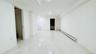 Empty room with a baseboard radiator, light marble finish floors, and recessed lighting