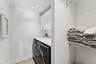 Laundry room featuring cabinet space, and independent washer and dryer.