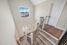 Stairway featuring wood-type flooring and a towering ceiling. For Marketing Purposes!