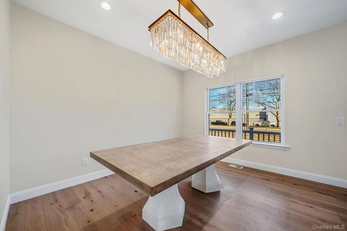 Unfurnished dining area featuring wood-type flooring and recessed lighting. For Marketing Purposes!