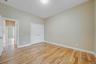 Unfurnished bedroom with light wood-style flooring and a closet. For Marketing Purposes!