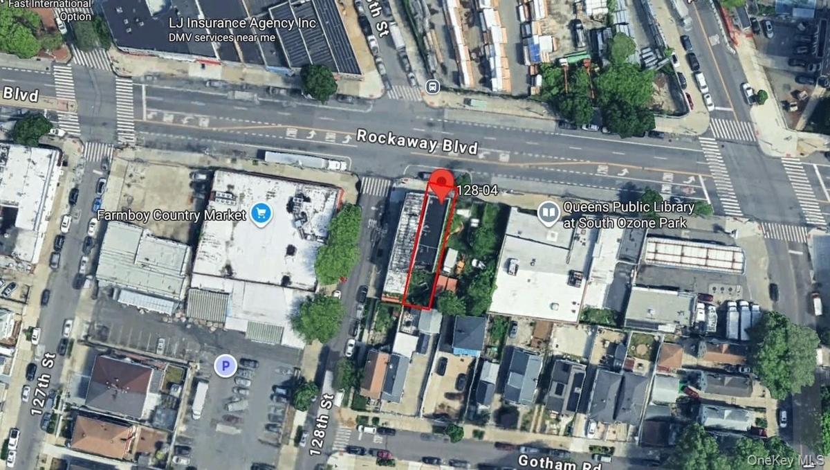 Aerial view of property and surrounding area with property parcel outlined