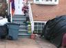 Property entrance with brick siding and a patio