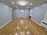 Spare room featuring recessed lighting, light wood finished floors, radiator, and crown molding