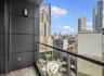 Balcony featuring a skyline view