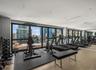 Exercise room featuring a city view