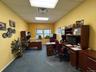 Office featuring a drop ceiling, carpet, and baseboards