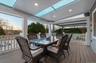 Wooden deck featuring outdoor dining area