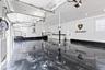 Garage with a garage door opener and independent washer and dryer