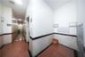 Corridor featuring mail area and arched walkways