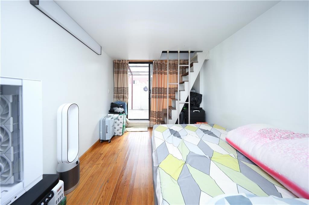 Bedroom featuring light wood-type flooring and access to exterior