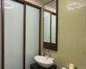 Bathroom with tile walls and vanity