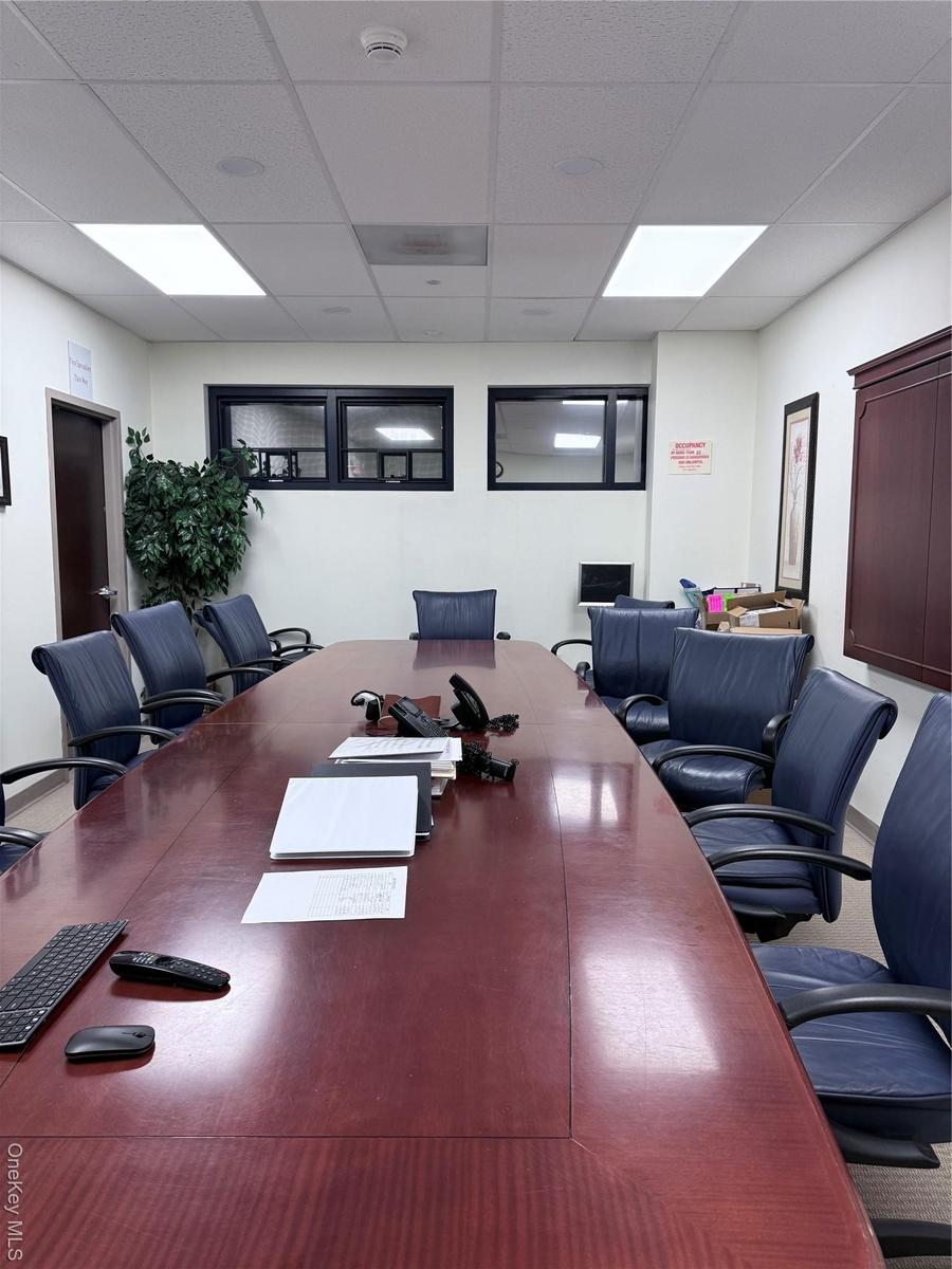 Office featuring a drop ceiling