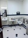 Bathroom featuring tile walls and a wainscoted wall