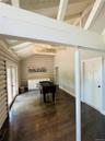 Game room featuring french doors, dark wood-style flooring, rustic walls, and wooden ceiling