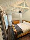 Bedroom featuring wood ceiling