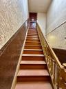 Stairway featuring wainscoting
