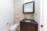 Bathroom featuring vanity, tasteful backsplash, and tile walls