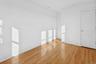 Empty room with light wood-style flooring and baseboards