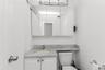 Bathroom with vanity and curtained shower