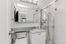 Bathroom featuring vanity and a shower stall