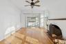 Unfurnished living room with hardwood / wood-style flooring and a ceiling fan