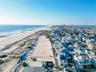 Aerial view of property's location featuring unending shoreline