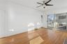 Spare room featuring hardwood / wood-style floors and a ceiling fan