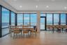Dining space featuring a water view, light wood finished floors, healthy amount of natural light, and recessed lighting