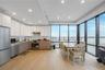 Kitchen with modern cabinets, white cabinetry, appliances with stainless steel finishes, and recessed lighting