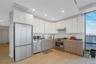 Kitchen featuring white cabinetry, modern cabinets, stainless steel appliances, and recessed lighting