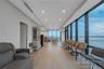 Living room featuring a wall of windows, light wood-style floors, recessed lighting, and a water view