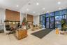 Common area with floor to ceiling windows and recessed lighting