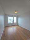 Empty room with baseboards and light wood finished floors