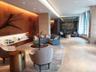 Community lobby featuring tile walls