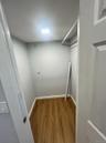 Walk in closet featuring wood finished floors