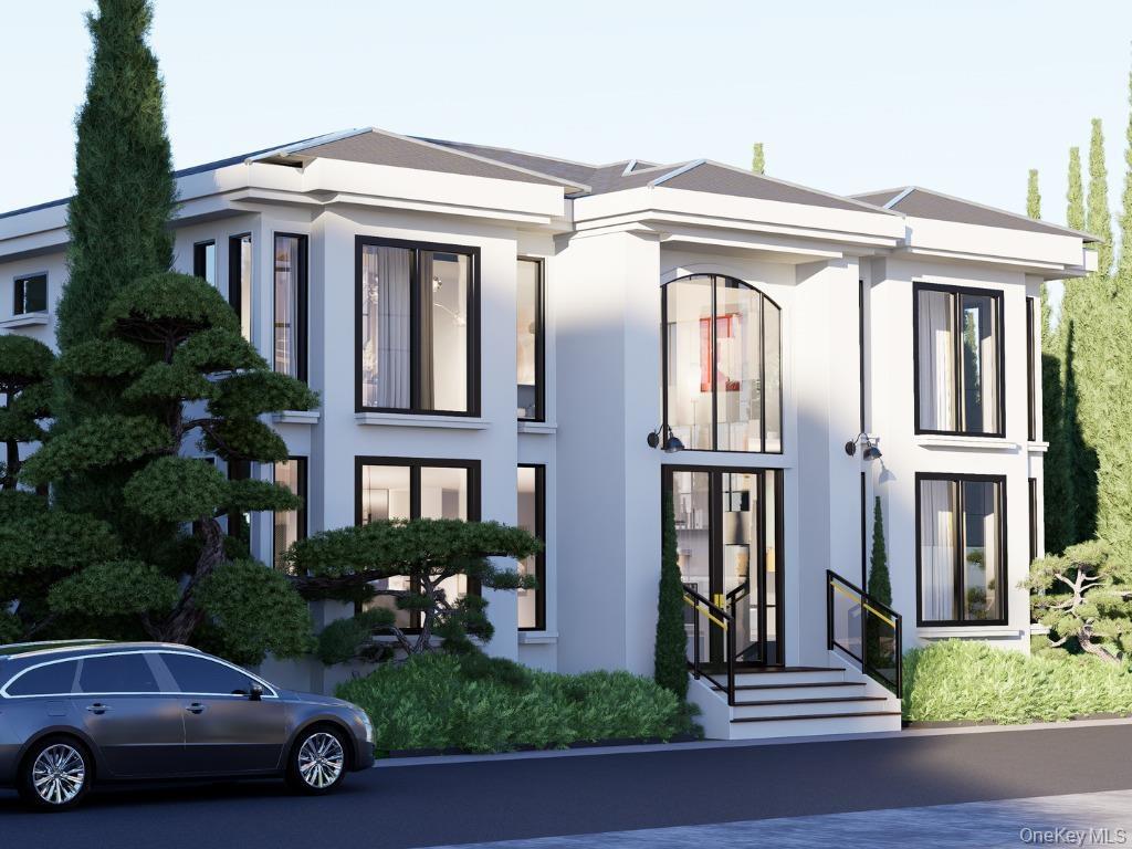 View of front of house featuring stucco siding