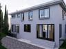 Back of property with stucco siding