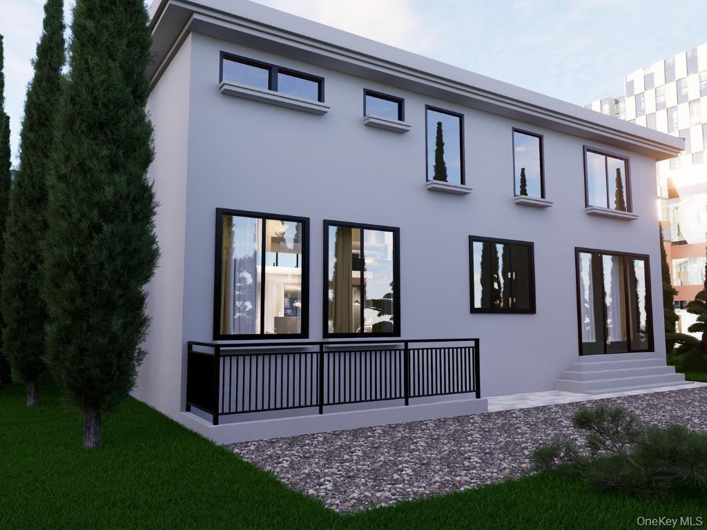 Back of house featuring stucco siding and entry steps