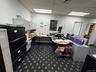Office space with a paneled ceiling
